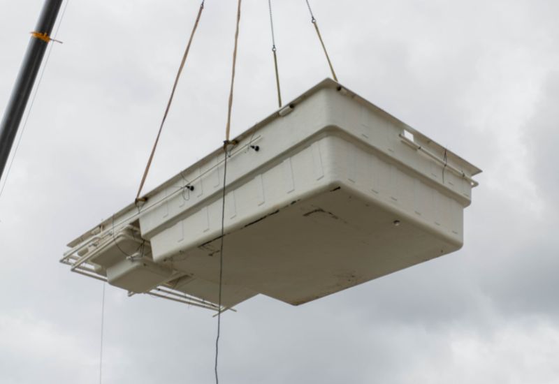 Pool shell prepared and connected for the crane lift