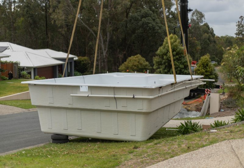 Crane on site ready to lift the pool shell